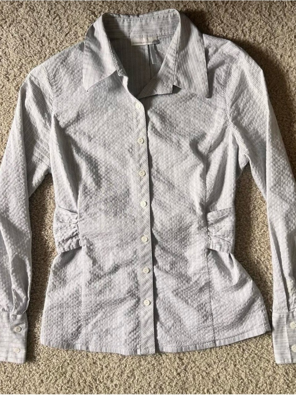 white striped pattered button up with a tie on the waist